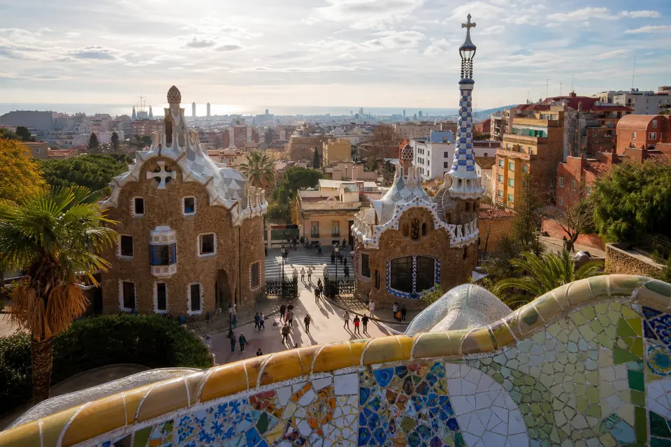 AI-generated illustration of visitors and mosaic architecture at Park Güell